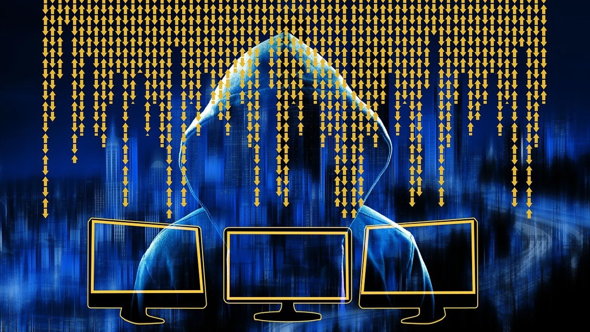Illustrazione di un hacker incappucciato davanti a piu' schermi con dati che scorrono